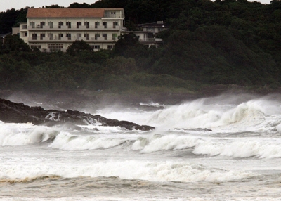 High waves crash into the coast at Hyuga in Miyazaki prefecture, Japan's southern island of Kyushu on July 16, 2015. (Jiji Press/AFP/Getty Images)