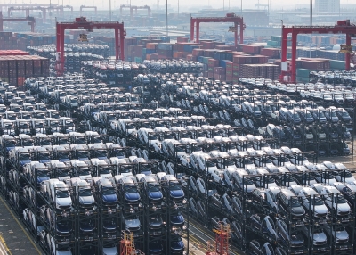 Stacked cars waiting to be loaded onto a ship