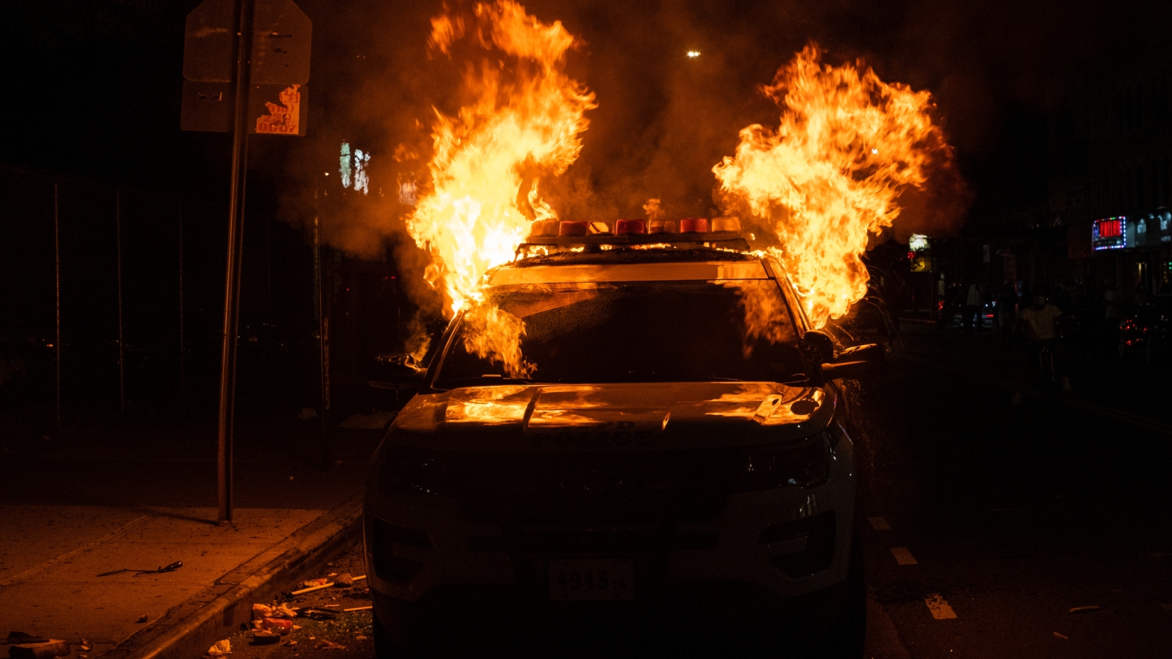 Flames engulf a New York Police Department (NYPD) vehicle in Flatbush, Brooklyn, on May 30, 2020.